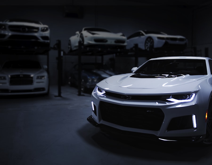 White sports car in a luxury garage with premium vehicles parked behind, representing well-protected coverage choices